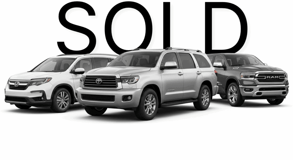 Row of silver and white SUVs and a pickup truck with SOLD in bold letters behind them, highlighting successful dealership sales—ideal for Willowood Ventures automotive marketing.
