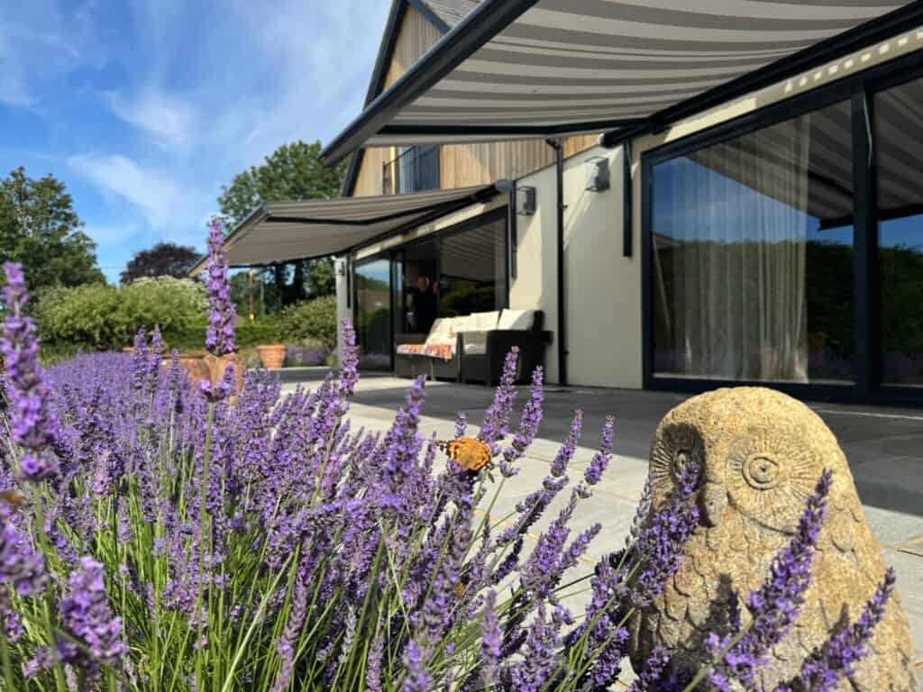 Motorised Weinor awning extending over a patio in Winchester