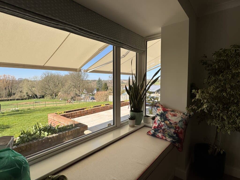 motorised awnings protecting furniture and reducing sun glare to a home in Alresford Hampshire