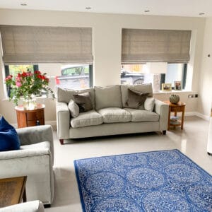 Grey Roman blinds in a living room itchen Abbas hampshire