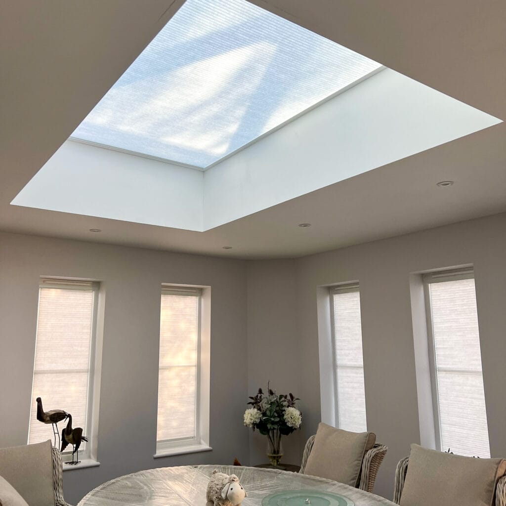 Cream Somfy electric roof lantern blind on a roof lantern window in a dining room in Romsey Hampshire