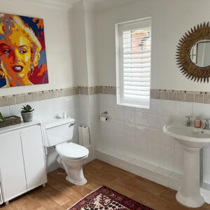 Waterproof bathroom shutters fitted to a bathroom window in Romsey Hampshire
