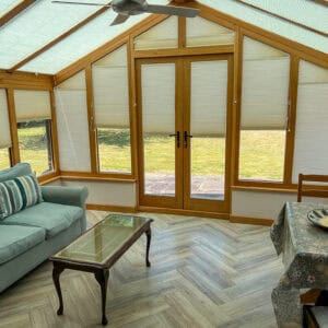 Pleated conservatory blinds reducing heat and glare while maintaining natural light in a Hampshire conservatory.