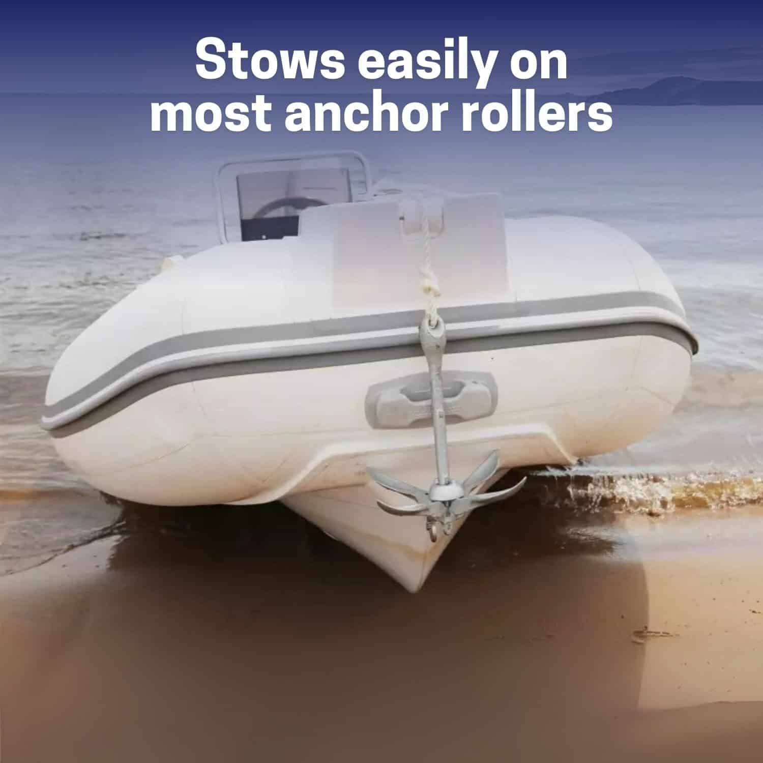 Inflatable boat on beach with anchor roller for easy stowage.