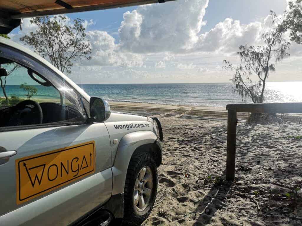 Wongai 4wd hire car sitting on Stradbroke Island beach