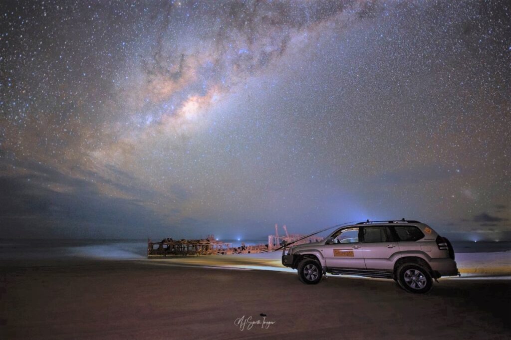 Fraser Island at night with 4wd on beach and full moon