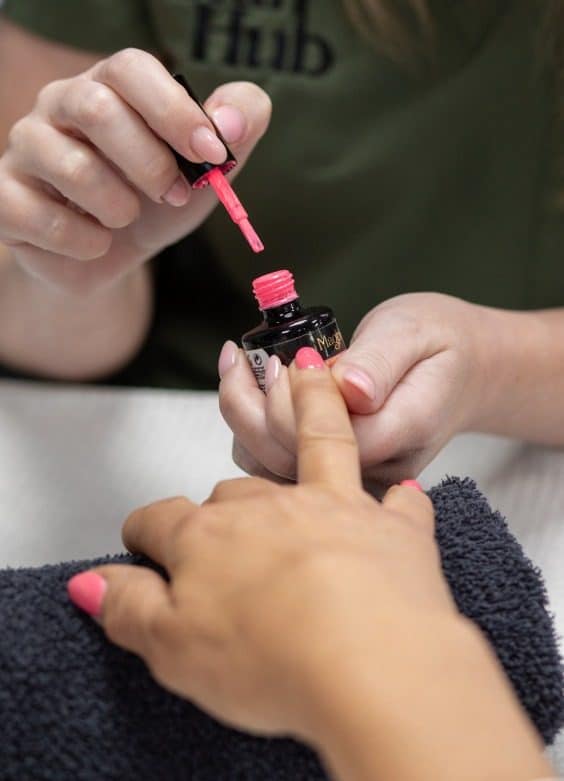 Therapist giving a nail treatment