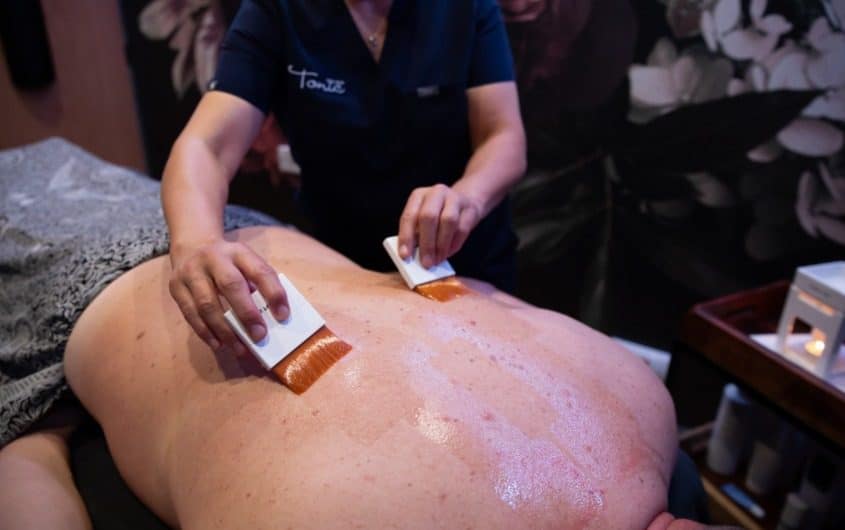 Therapist using oils before a massage