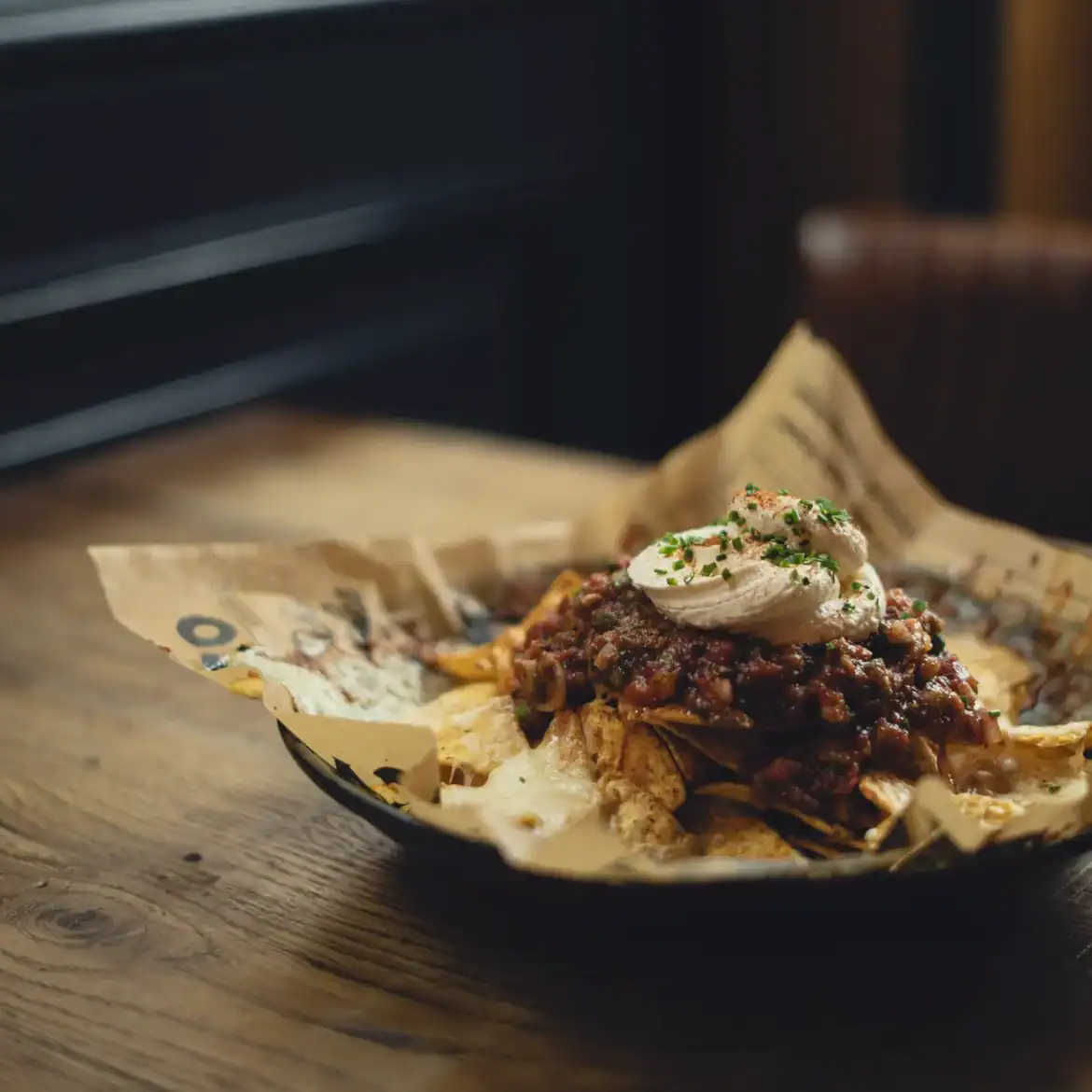 Delicious loaded nachos with toppings at Belushi's during the World Cup.