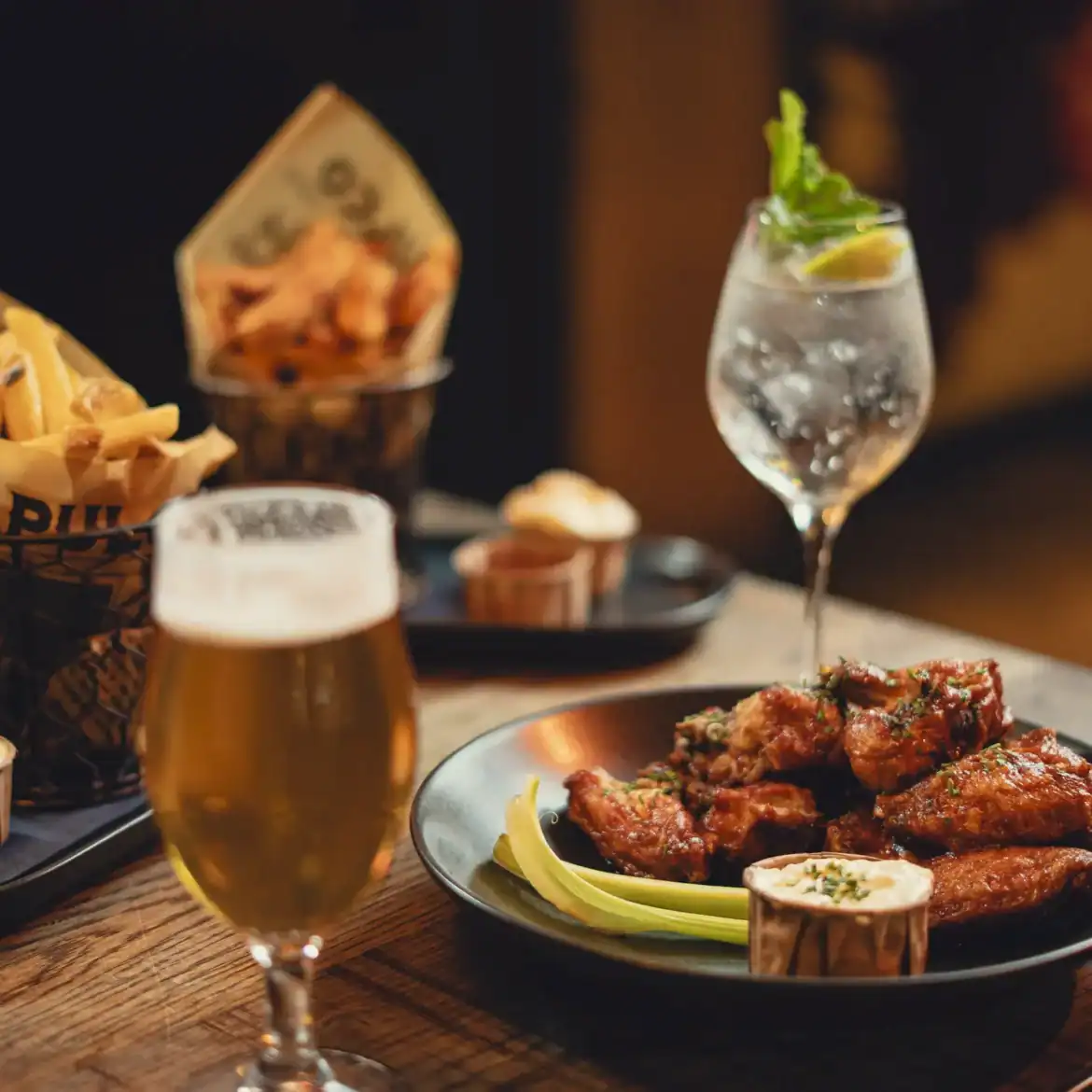 Vibrant image of food and drinks at Belushi's Amsterdam during the World Cup event.