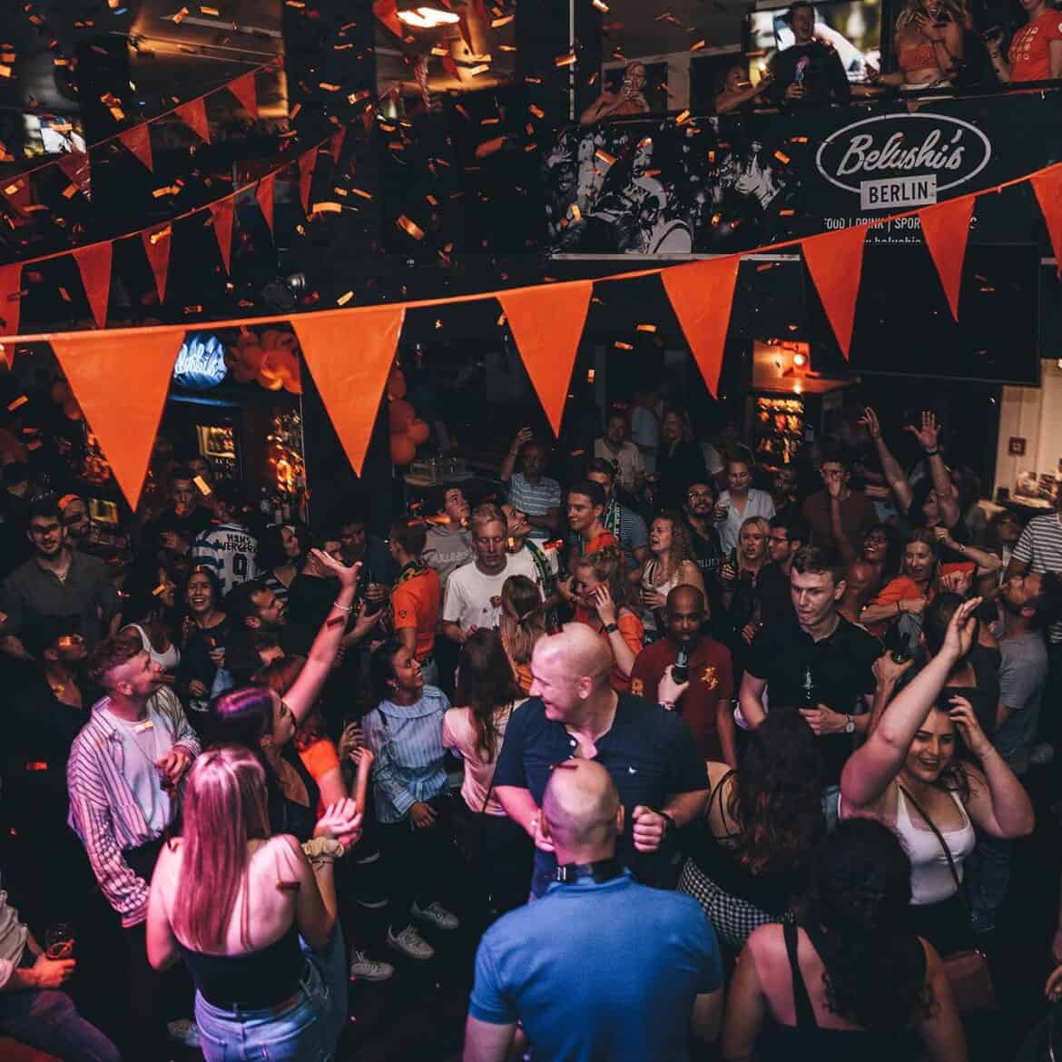 Crowd enjoying a lively event at Belushi's Berlin during the World Cup.
