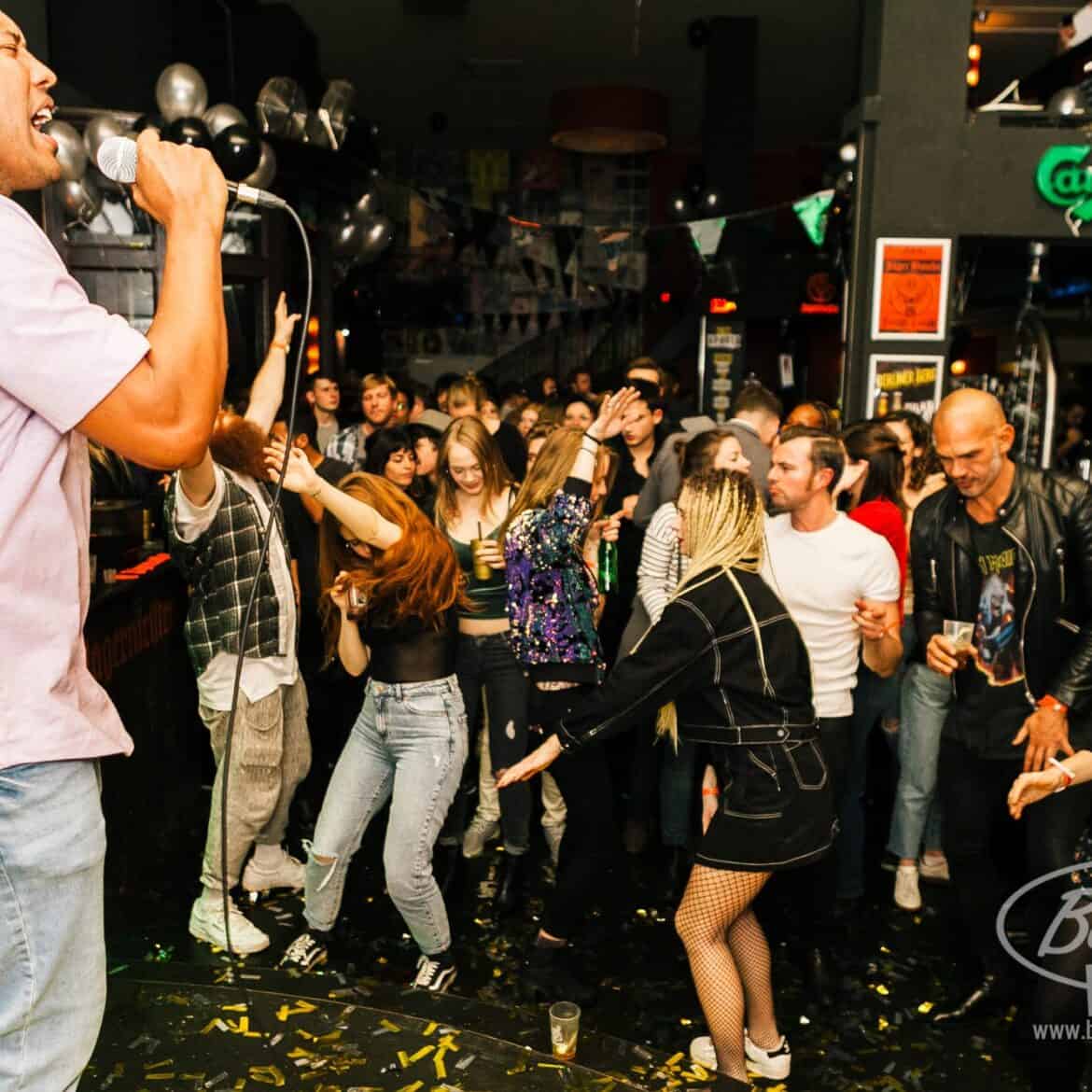 Crowd enjoying live music at Belushi's Berlin during the World Cup event.