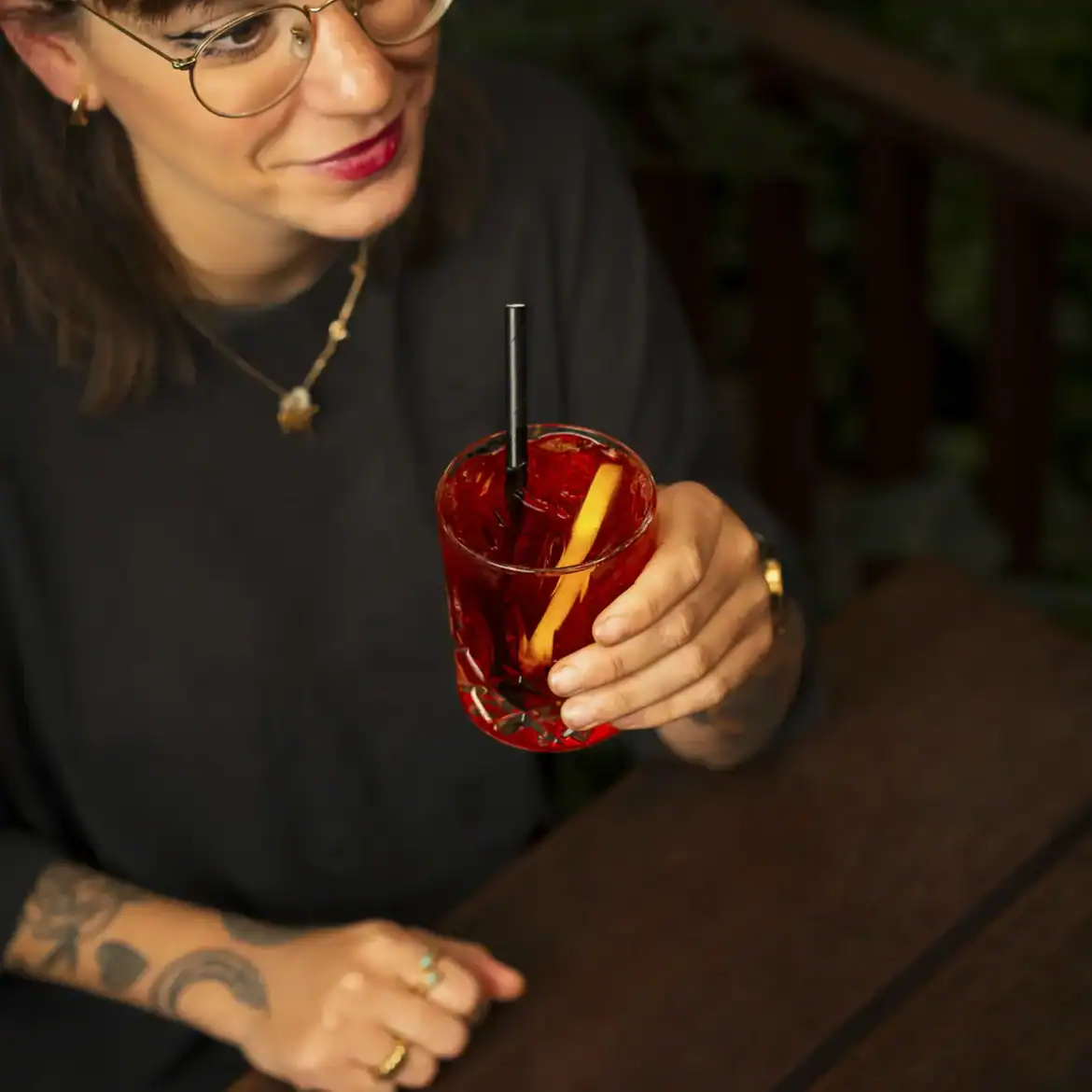 Woman enjoying a cocktail at Belushi's during the World Cup.