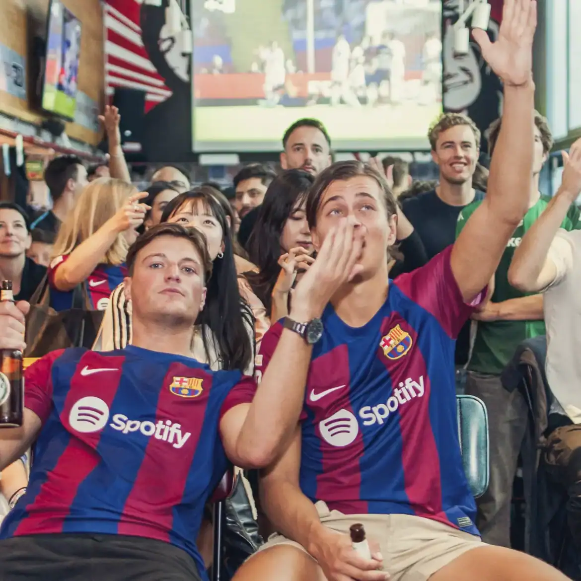 Fans watching and cheering at Belushi's during the World Cup.