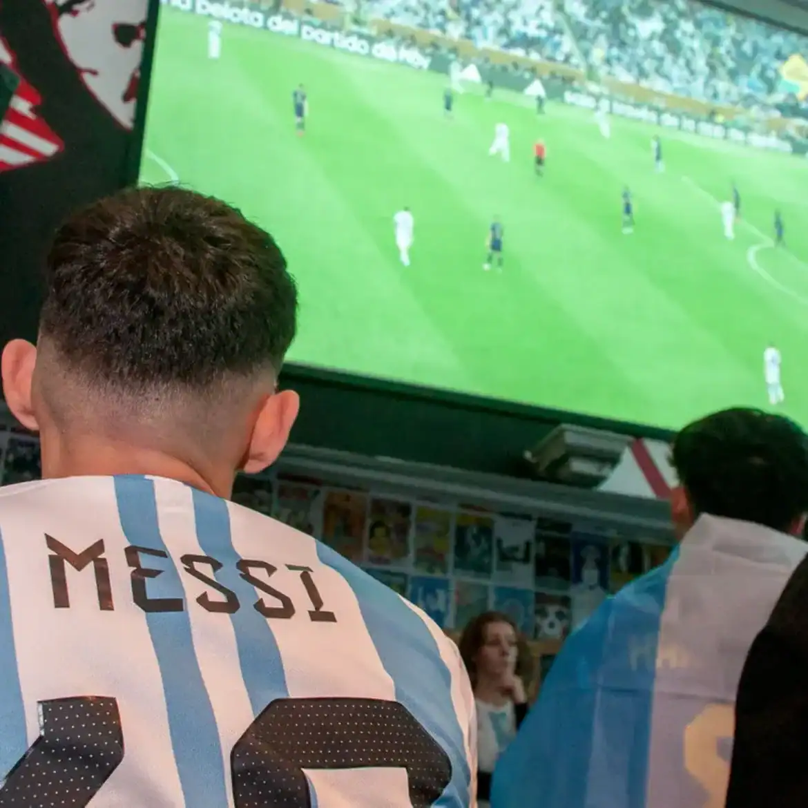 Fans watching live football match at Belushi's during the World Cup.