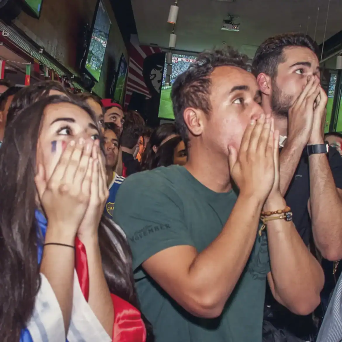 Fans watching live football at Belushi's during the World Cup.
