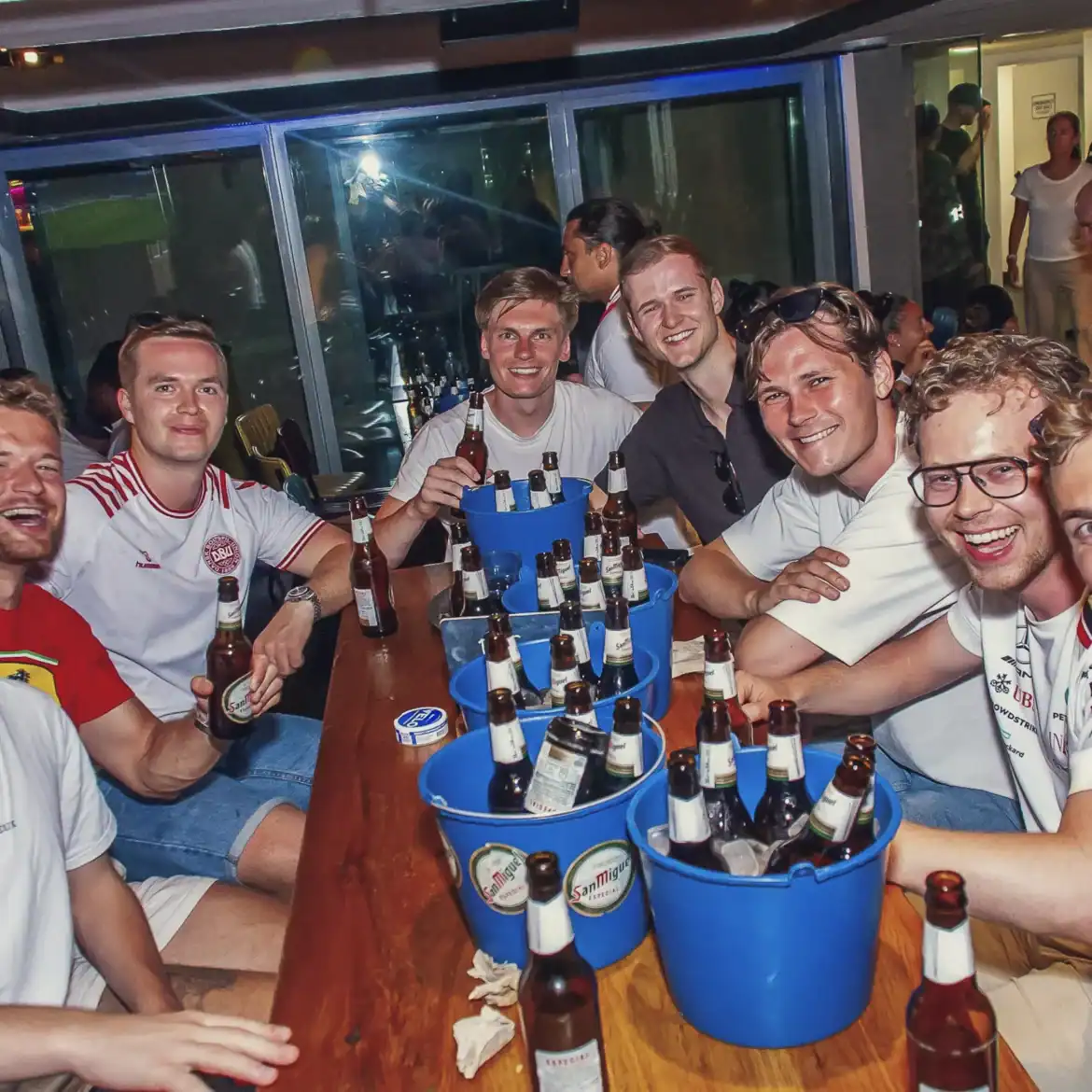 Group of friends enjoying drinks at Belushi's during the World Cup.