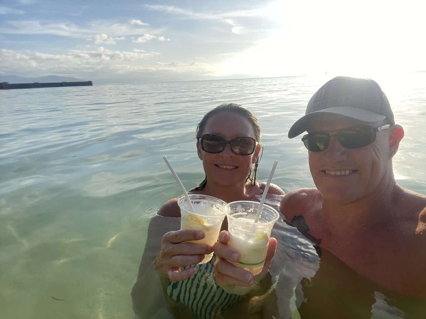 My husband and I enjoying a sunset swim and cocktails on Green Island. A fun thing to do for guests staying on the island. after day trippers have gone home.