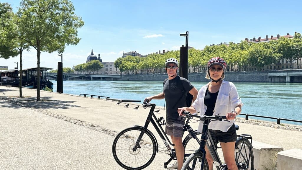 Ebike riding along the Rhone River in Lyon. A fun activity on our river cruise with Avalon. River Cruise Small Ship Cruise Inspiration for 2026.
