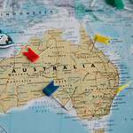 Colorful map of Australia featuring toy ships and pins for navigation. Australia Travel Tips for Americans Over 50