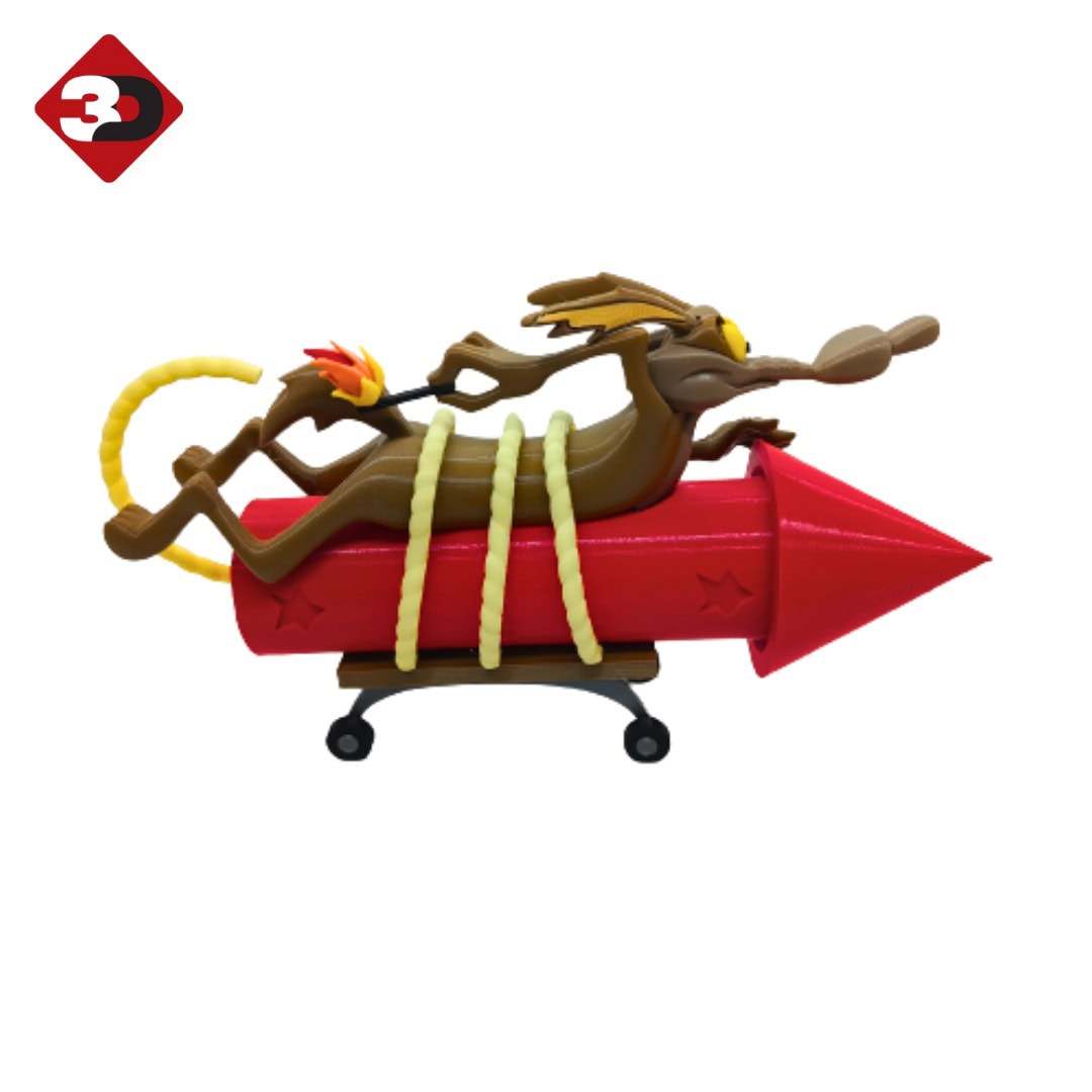 Dibujo 3D de un diablillo en plástico, con cuerpo de color marrón y detalles en amarillo y rojo, sobre un misil rojo en una estructura con ruedas, diseñado por 3D Casa Bureu Plásticos.