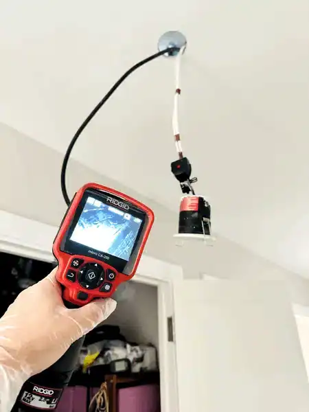 Plumber-Using-Ridgid-Camera-For-Ceiling-Leak-Detection
