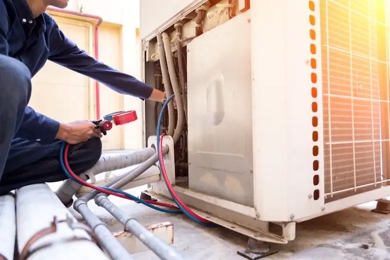 HVAC-Technician-Charging-Outdoor-AC-Unit-Refrigerant-Lines