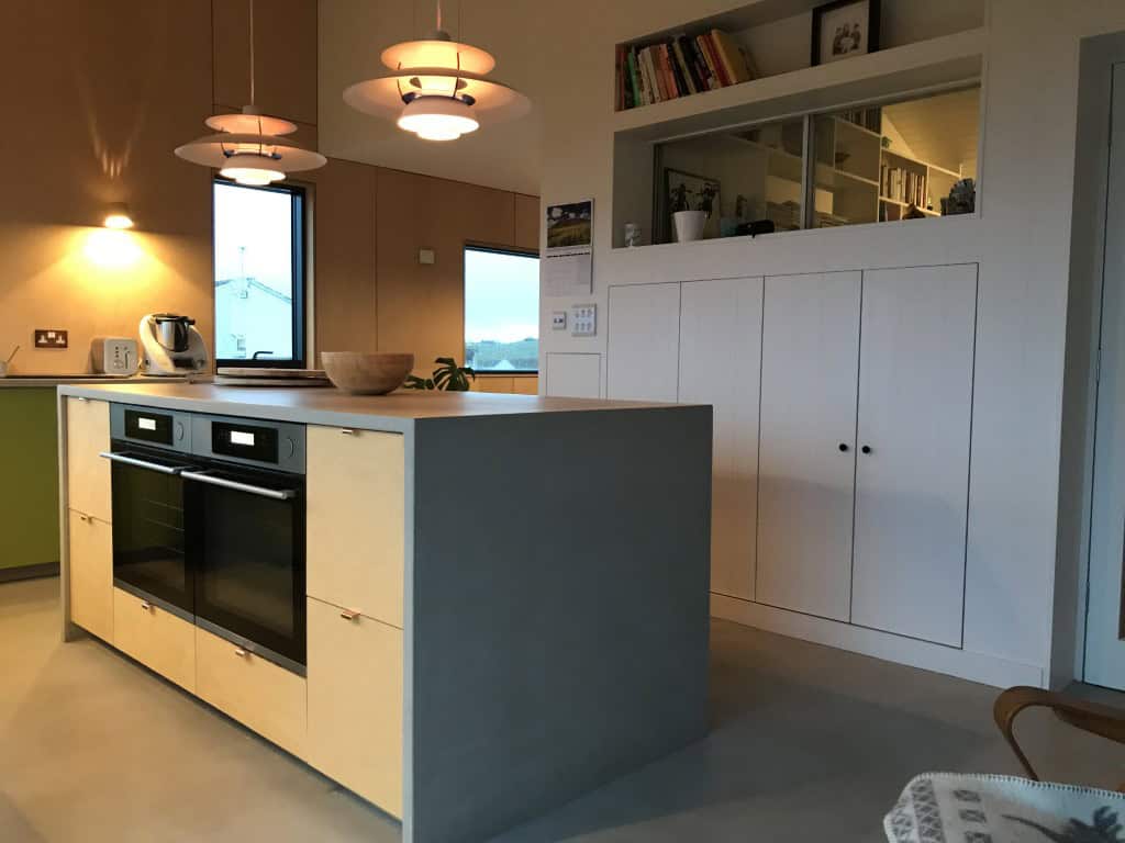 Contemporary kitchen featuring modern appliances, open shelving, and natural light for stylish living.