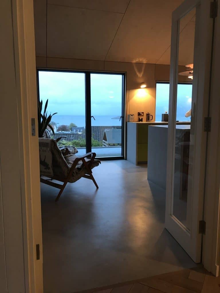 Bright coastal apartment with large windows overlooking the sea and spacious interiors.