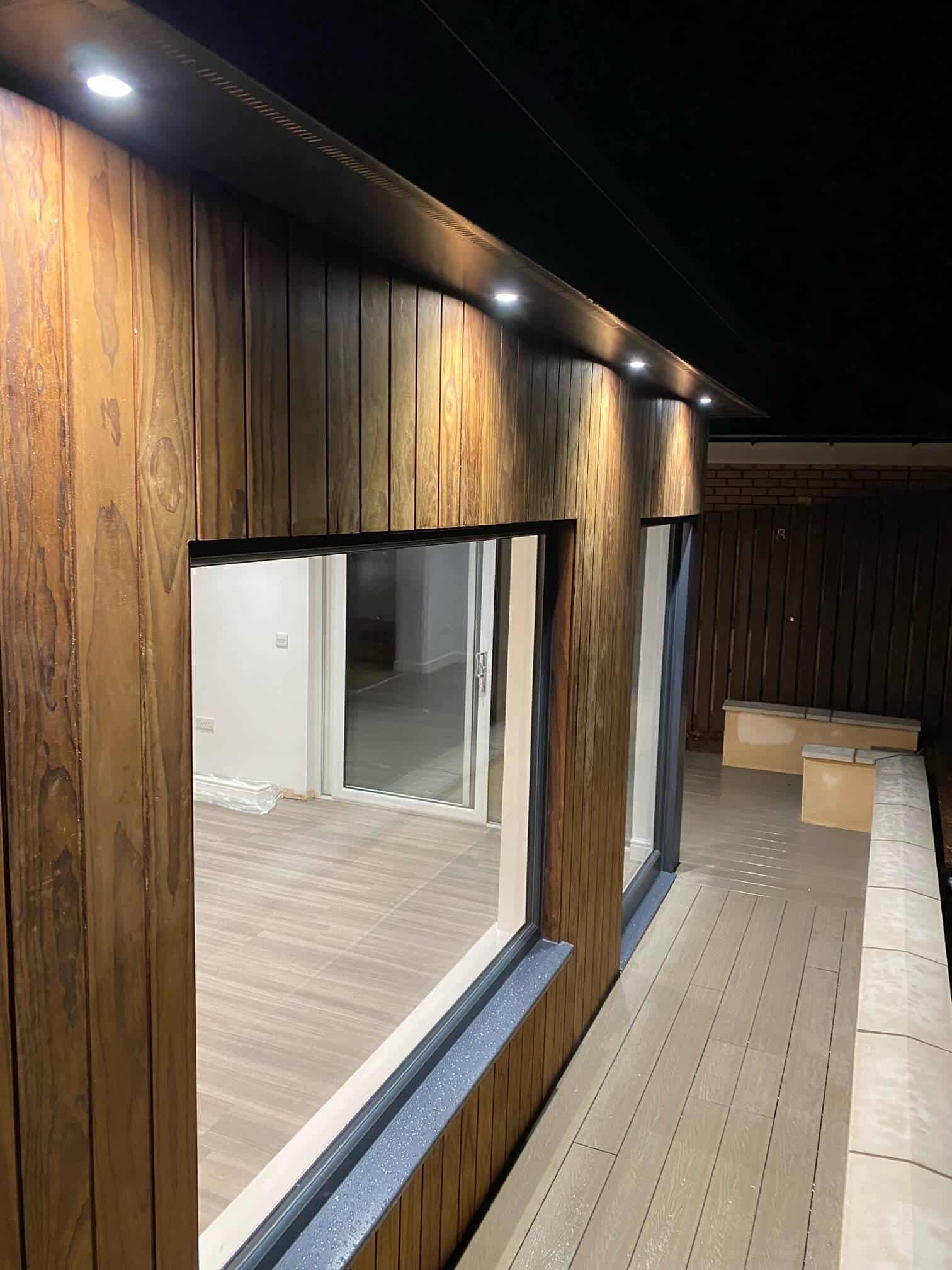 High-quality timber facade with integrated outdoor lighting, enhancing contemporary architectural design.
