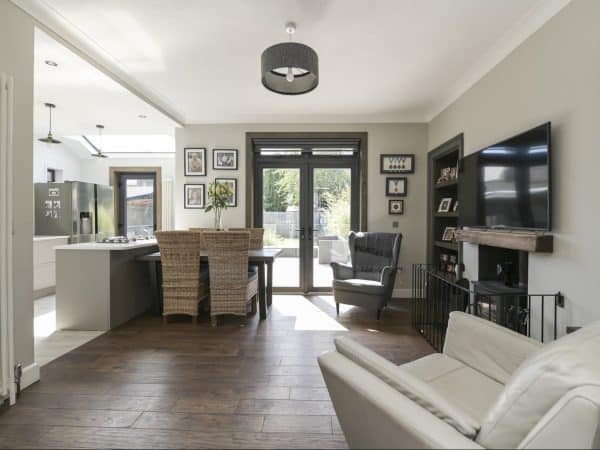 Spacious interior featuring contemporary kitchen, seating, and natural light.