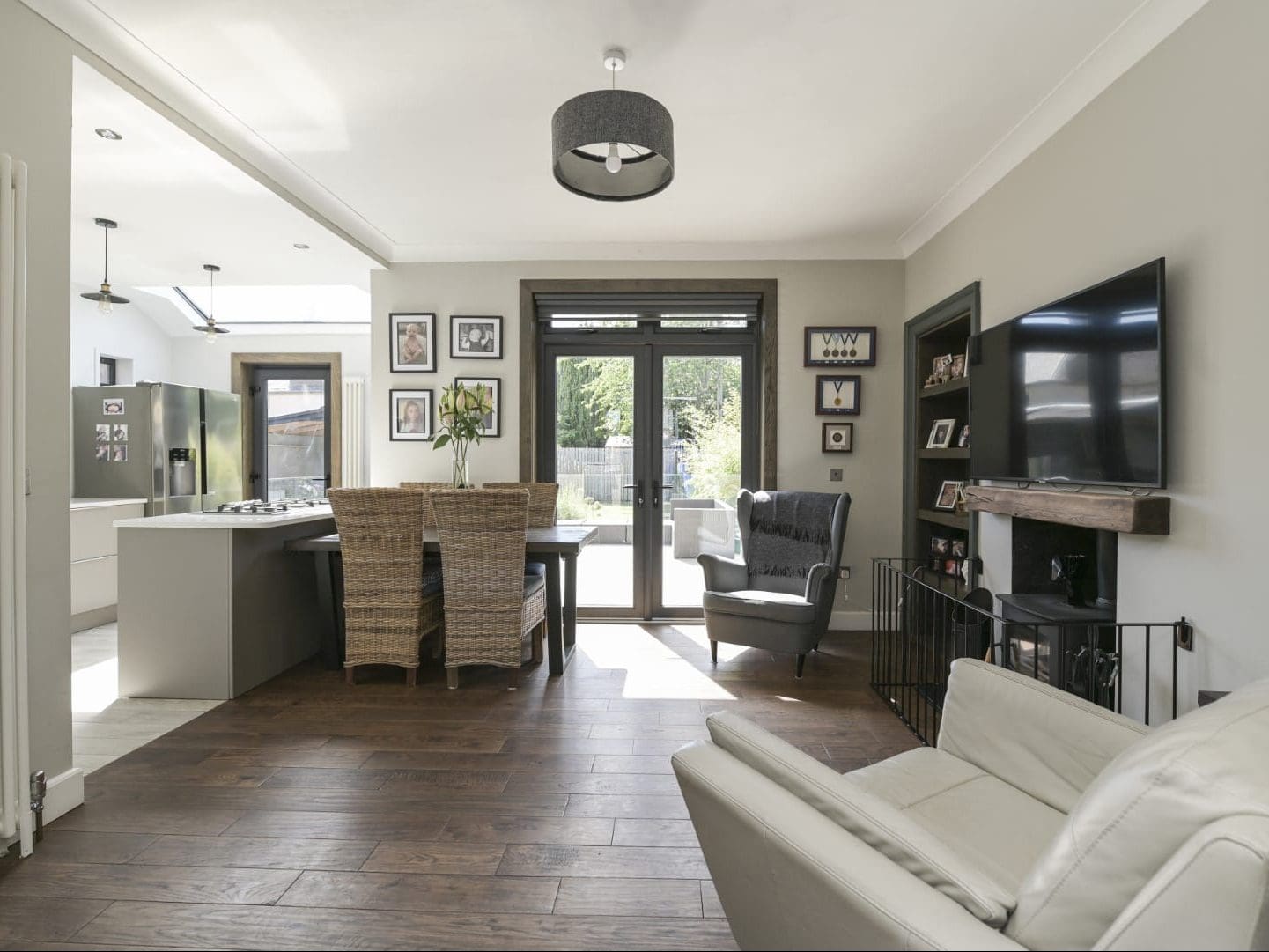 Spacious interior featuring contemporary kitchen, seating, and natural light.