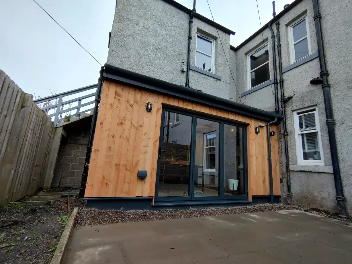 Elegant garden transformation with timber and glass, enhancing outdoor space for modern living.