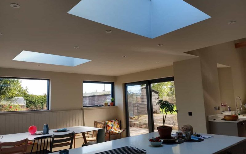 Bright kitchen with skylights, natural light, and contemporary design, perfect for modern homes.