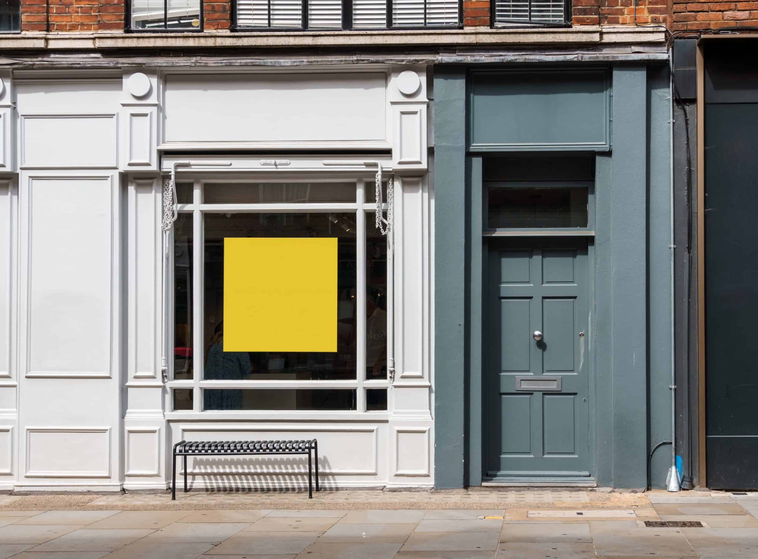 Urban shop front architecture with sleek white and blue facades, ideal for retail spaces.