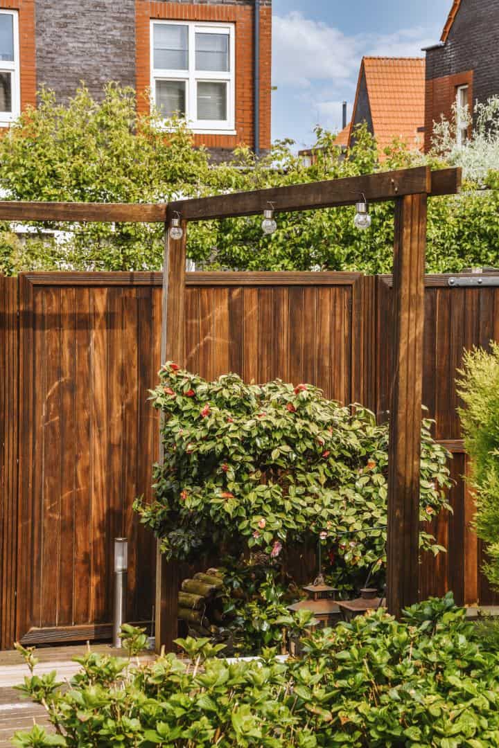 View of the wooden fence and neighboring houses