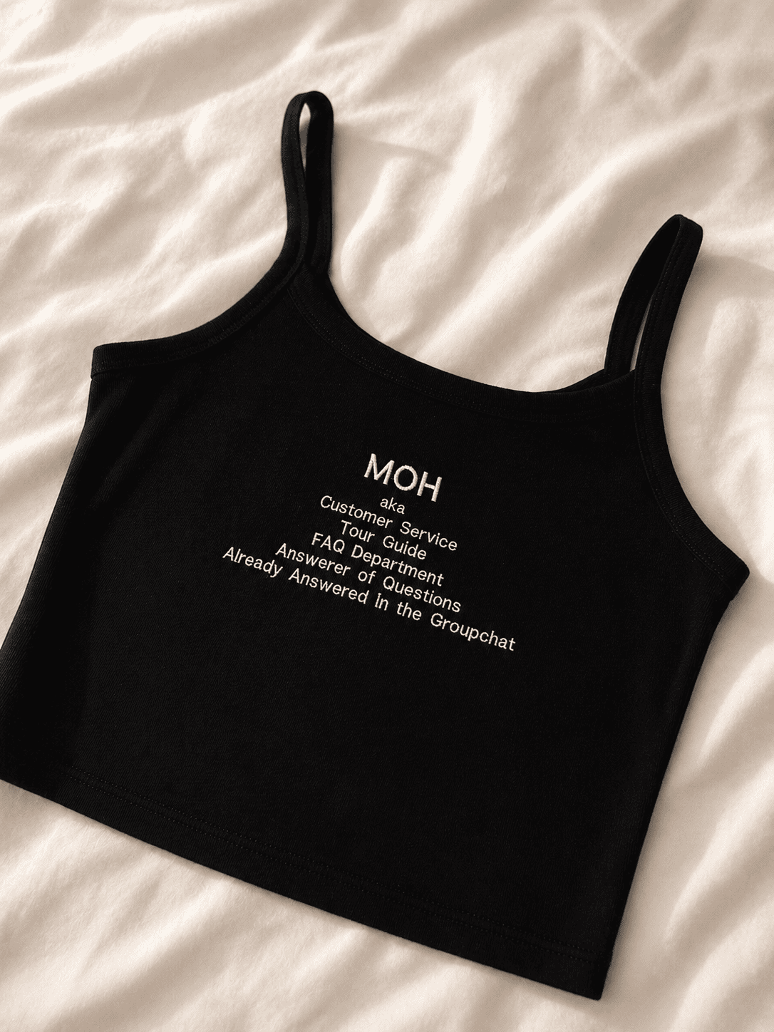 Black tank top with "MOH" and customer service details embroidered in white.