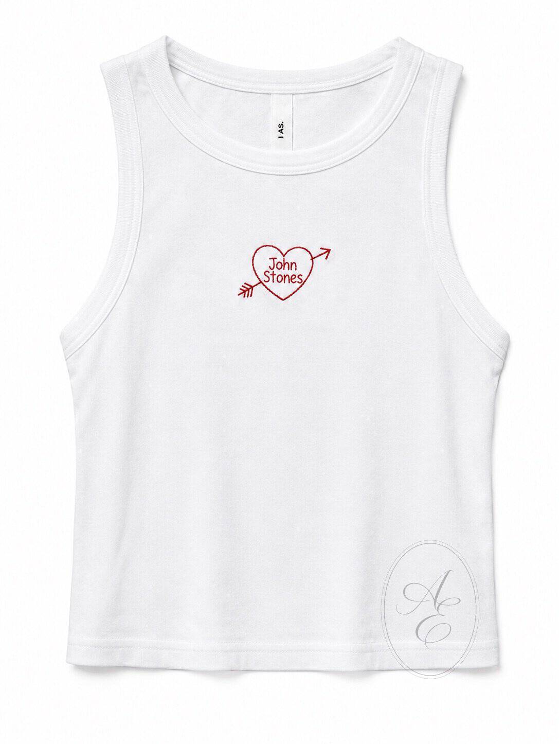 Embroidered tank top featuring a heart with "John Stones" and an arrow, ideal for custom sports or c.