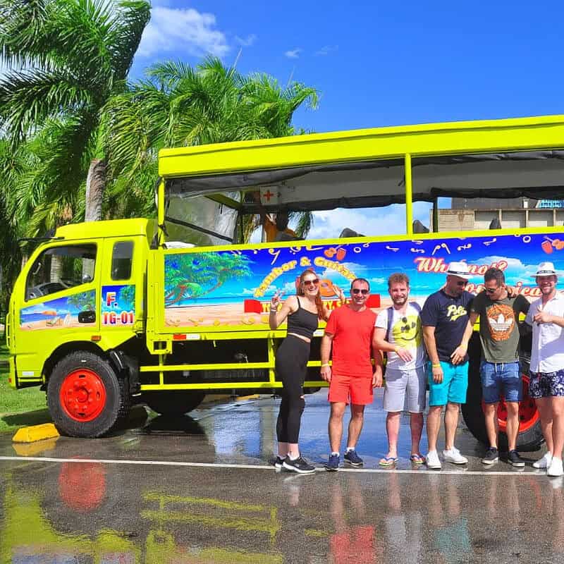 Punta Cana Bright yellow tour bus with tourists in Bavaro, Punta Cana, Dominican Republic.