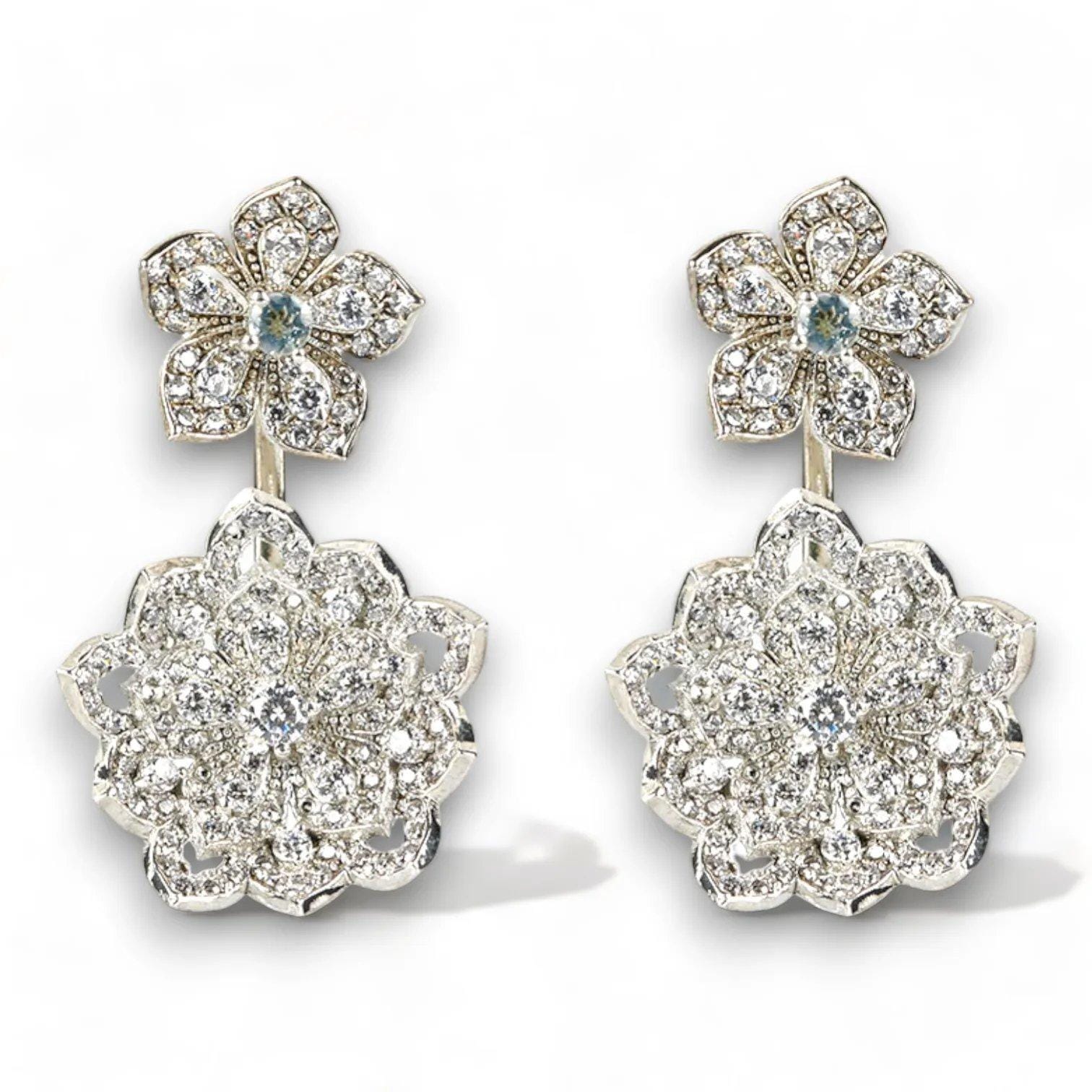 Stunning silver flower earrings adorned with sparkling crystals, perfect for elegant jewelry collections.