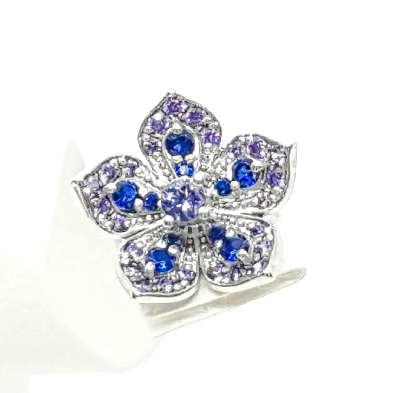Delicate butterfly-shaped jewelry with blue and purple gemstones, elegant and stylish accessory.