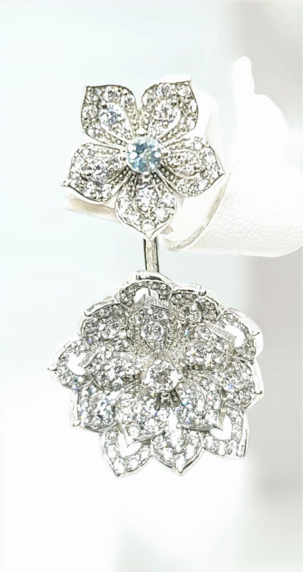 Elegant diamond flower-shaped jewelry piece with intricate design and sparkling stones.