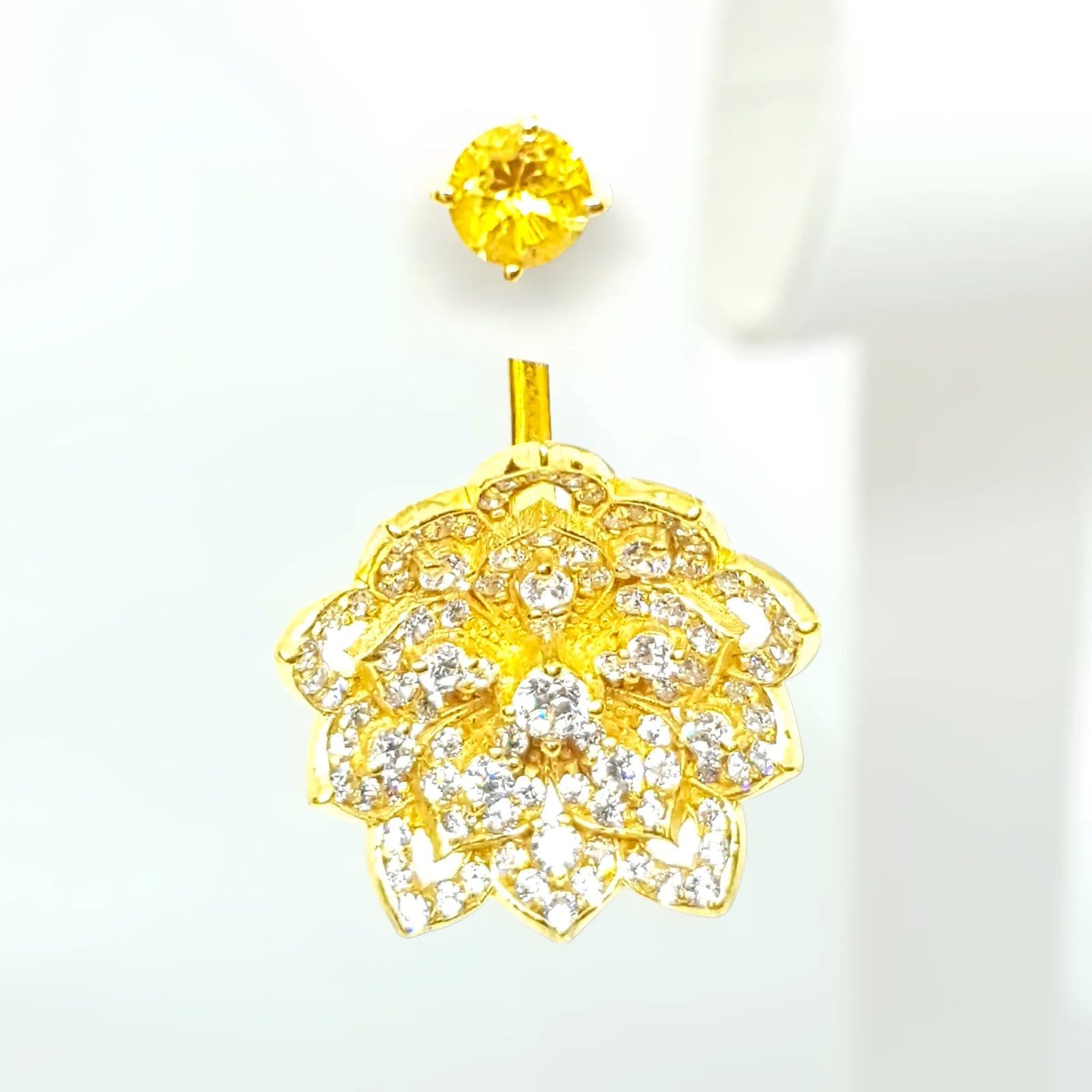 Yellow gemstone earring and ring jewelry set with floral design featuring diamonds, luxurious gold finish.
