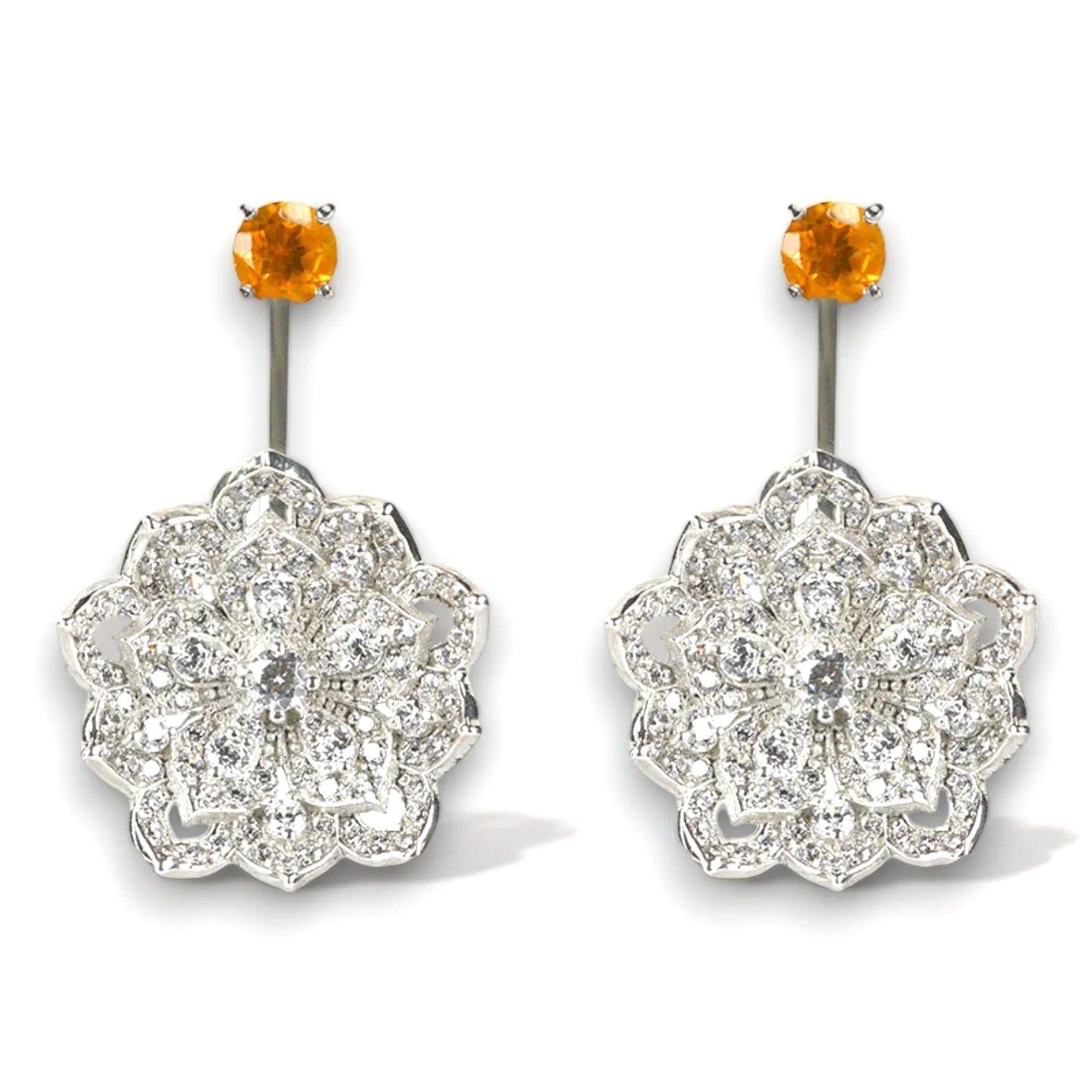 Orange gemstone belly button rings with flower-shaped diamond accents.