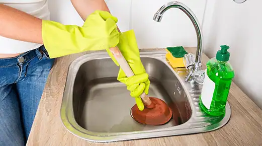 Plunger to clear a blocked sink