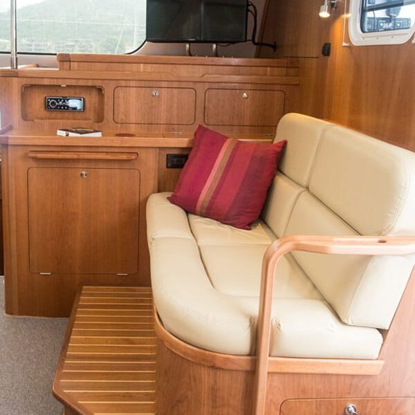 The raised forward facing seating in the optional saloon layout includes 2 storage drawers below