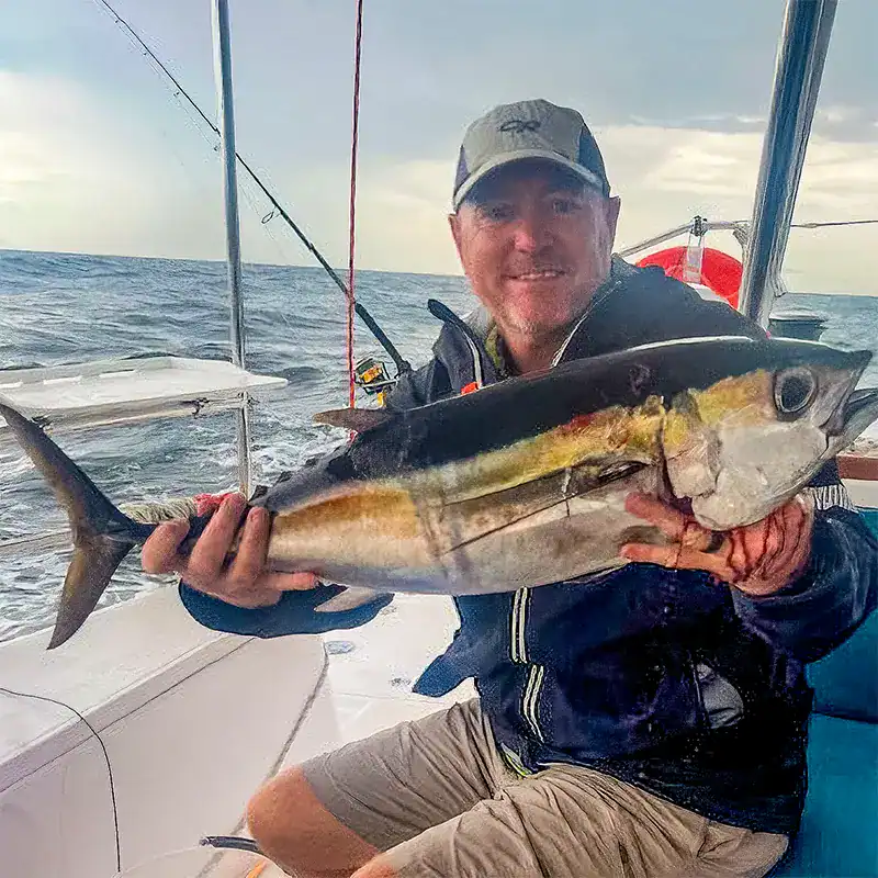 Caught a large fish on a sleek Antares catamaran during a fishing trip in open waters. The boat provides comfort and stability for unforgettable marine adventures, combining luxury with performance.