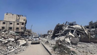 Torn Gaza city with destroyed buildings and rubble.