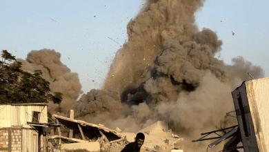 Explosion and smoke over Gaza buildings after Israeli airstrikes.