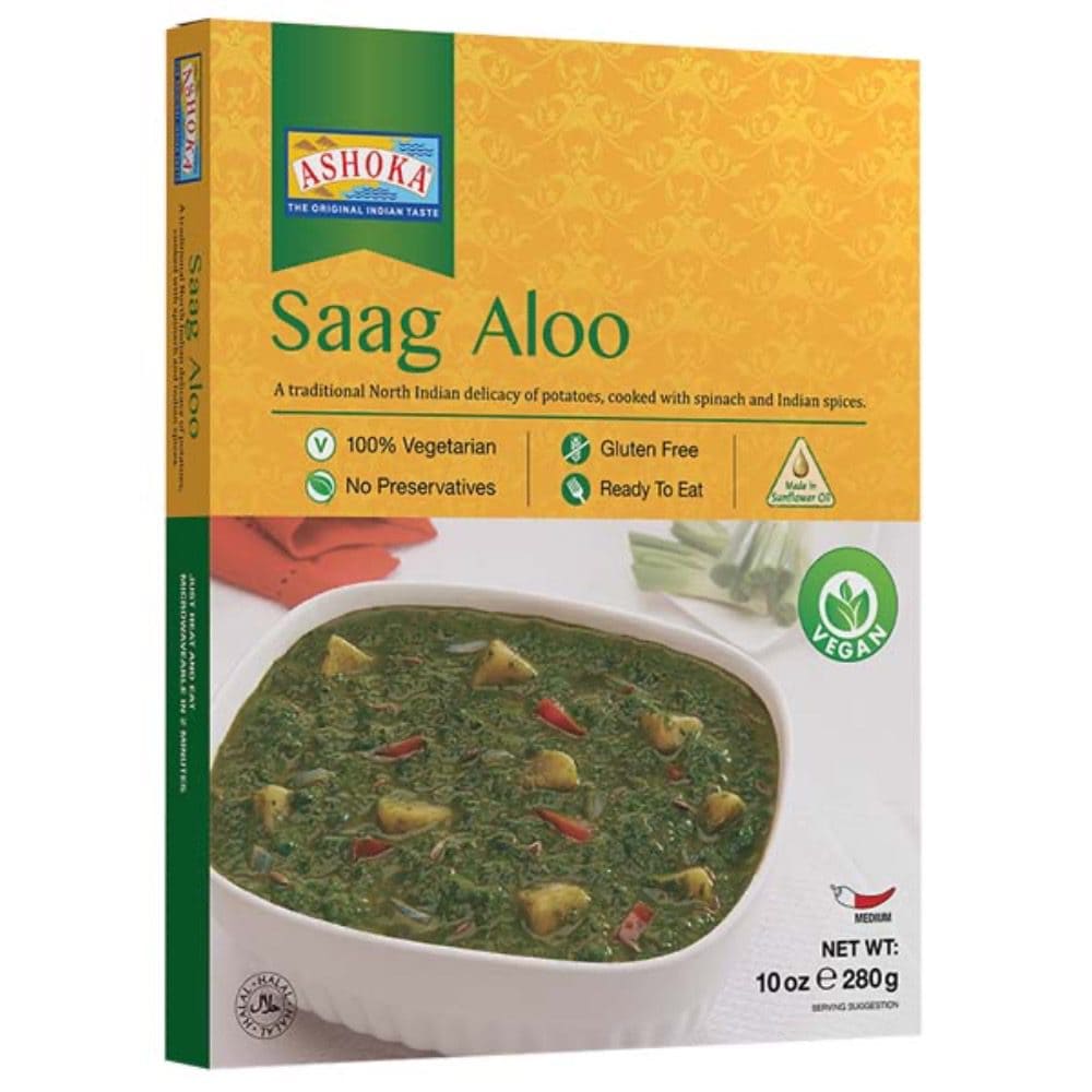 Asiatischer Lebensmittelladen - Veganes, glutenfreies Saag Aloo im Glasbehälter.